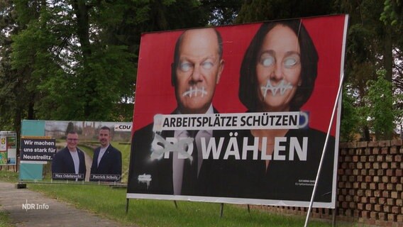Ein verschandeltes Wahlplakat der SPD, das Bundeskanzler Olaf Scholz und die Europa-Spitzenkandidatin Katarina Barley zeigt. © Screenshot 